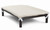 Cream color fleece accessory pad shown on top of a pvc bed, the pad is held to the bed by elastic straps that hook each the legs of the bed